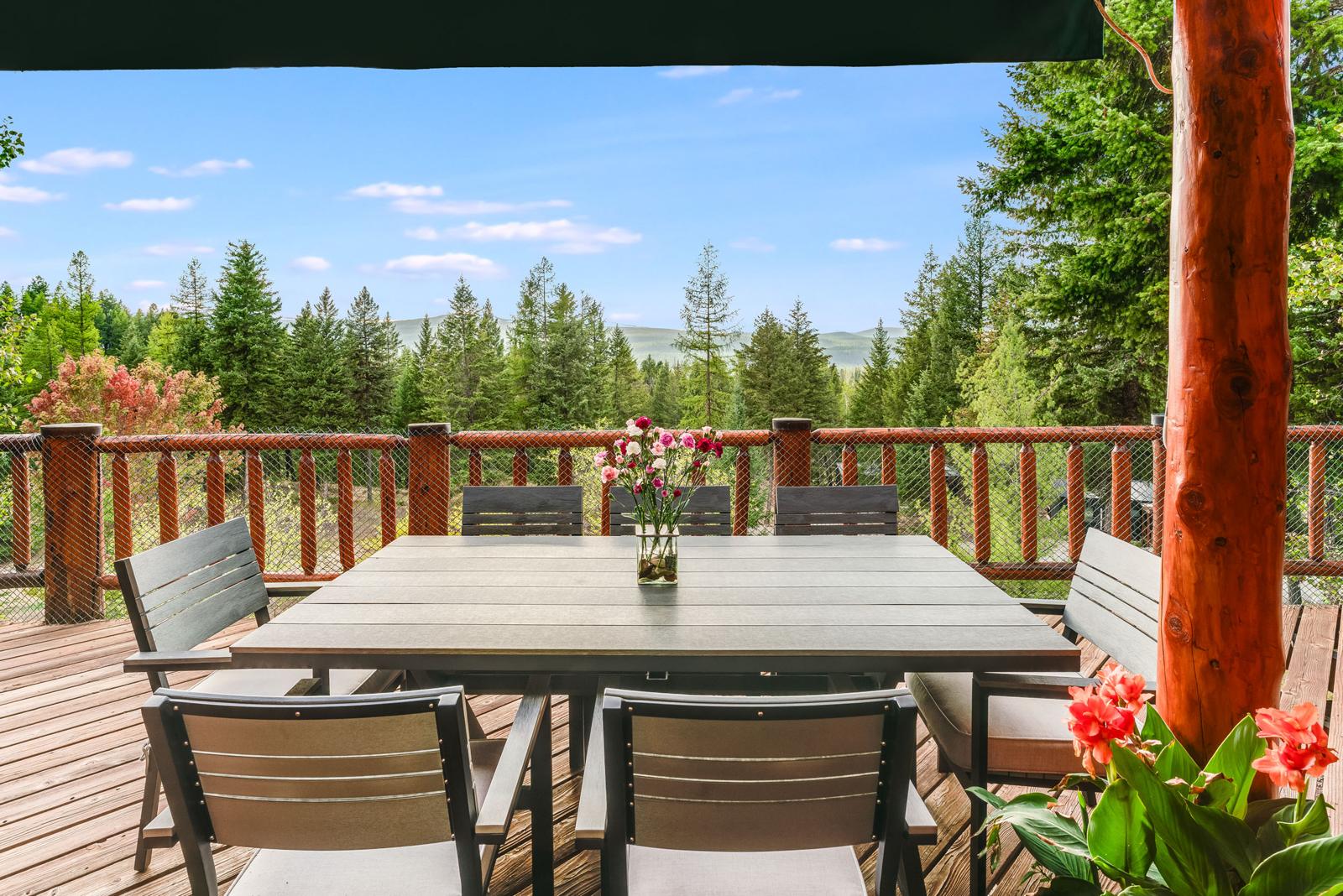 Deck overlooking forested hills at North Star Ranch near Whitefish, Montana