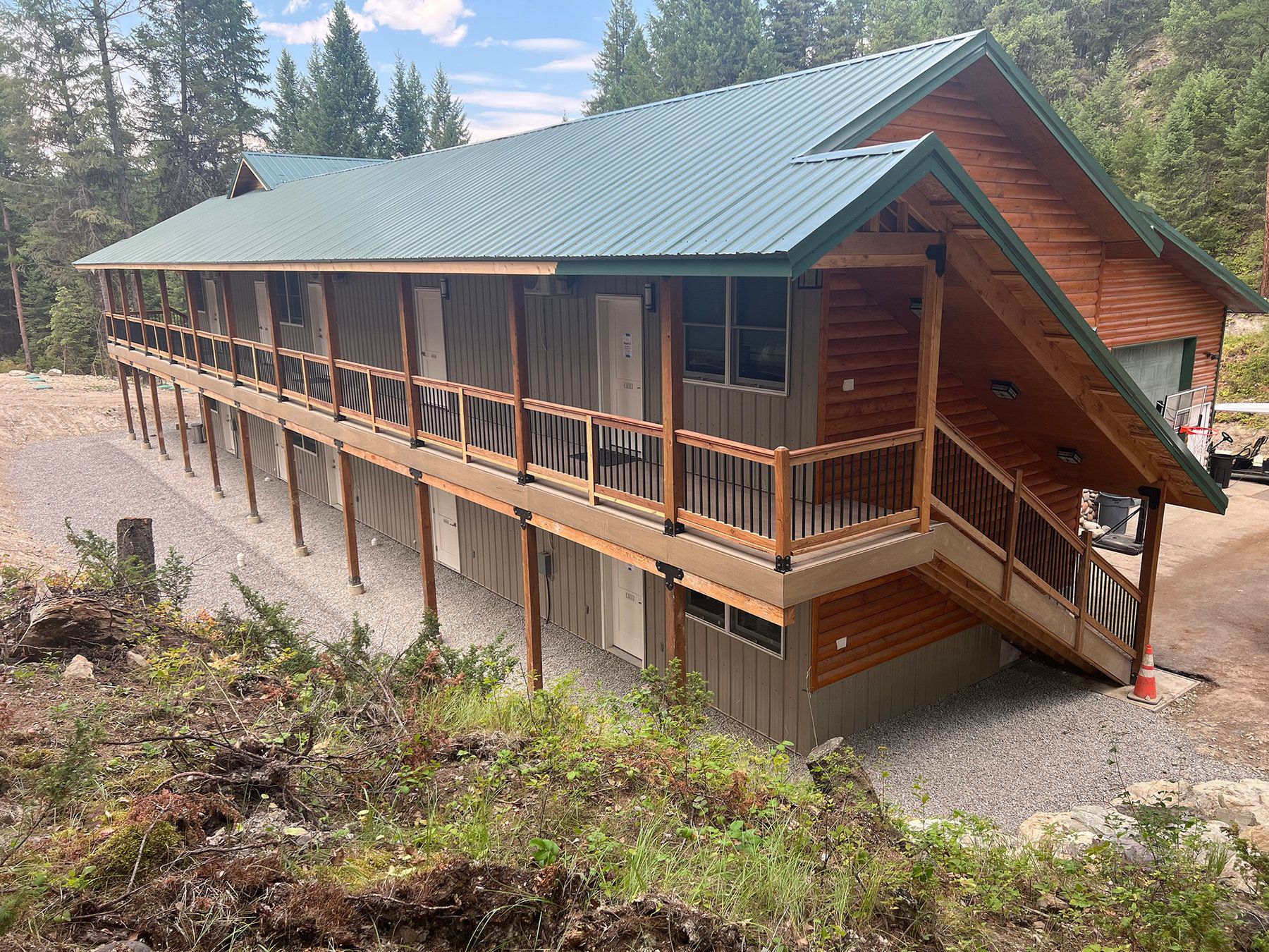 Two-story lodge with covered balconies among the pines at North Star Ranch